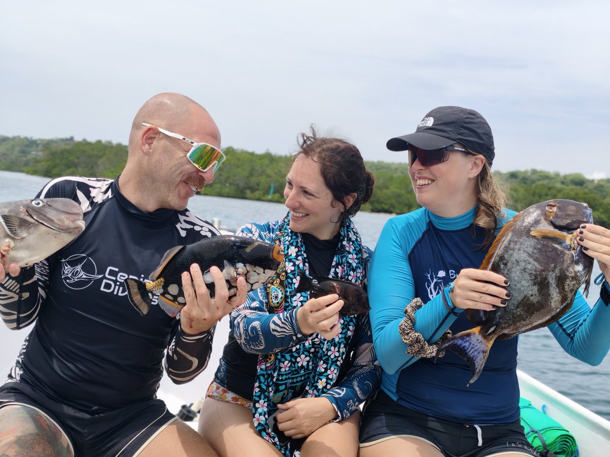 Guests laughing on board with their catch